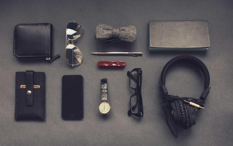 Camera gear laid out on a grey table
